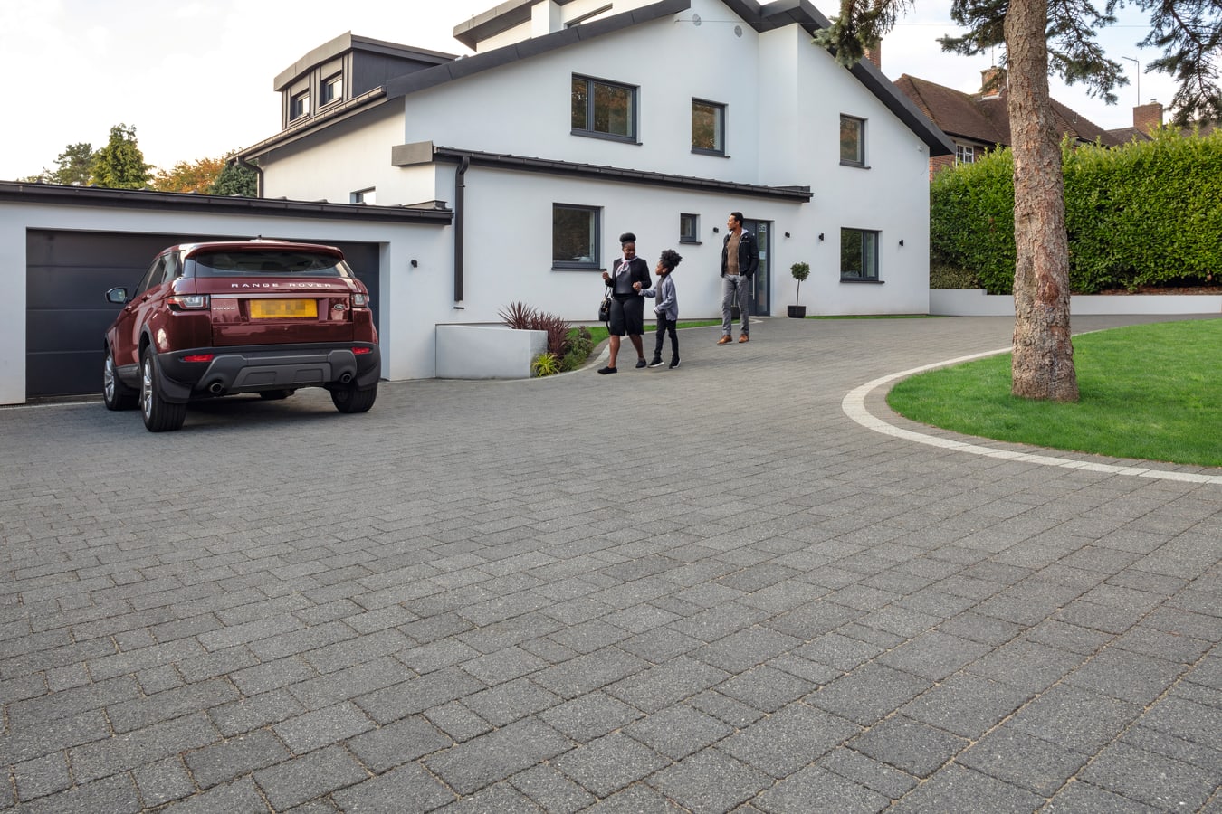 Marshalls Drivesett Argent Block Paving in Dark colour installed with light bordder.